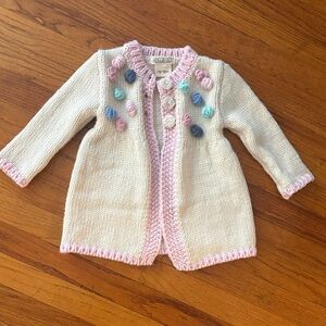 Huggalugs Cream Knit Baby Cardigan with Pastel Rosettes
